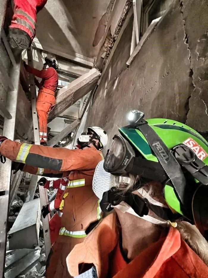 Deborah works with firefighters in the wreckage