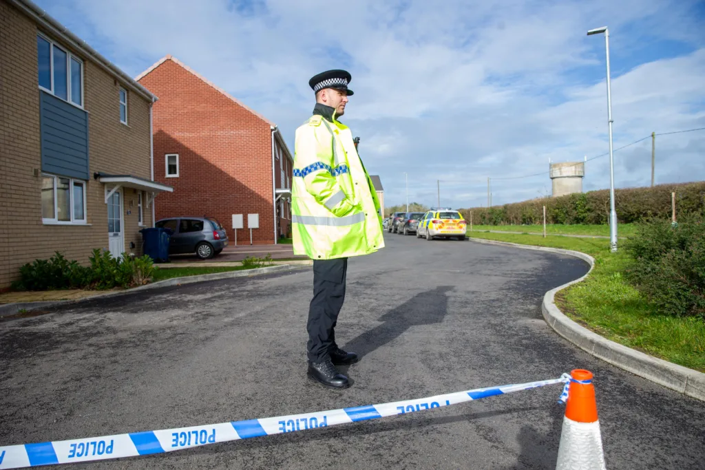 Scene of one of two murders in Cambridgeshire last night: police at a house in Meridian Close, Bluntisham, where the body of one of the victims was found at just after 9pm following reports reports of gunshots.