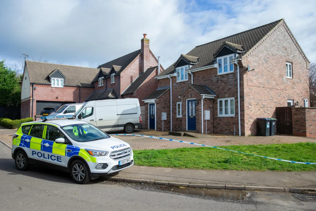 Scene of one of two murders in Cambridgeshire last night: police at a house in The Row, Sutton, where the body of one of the victims was found. Police are treating the attacks as targeted and say there is no wider risk to the general public.