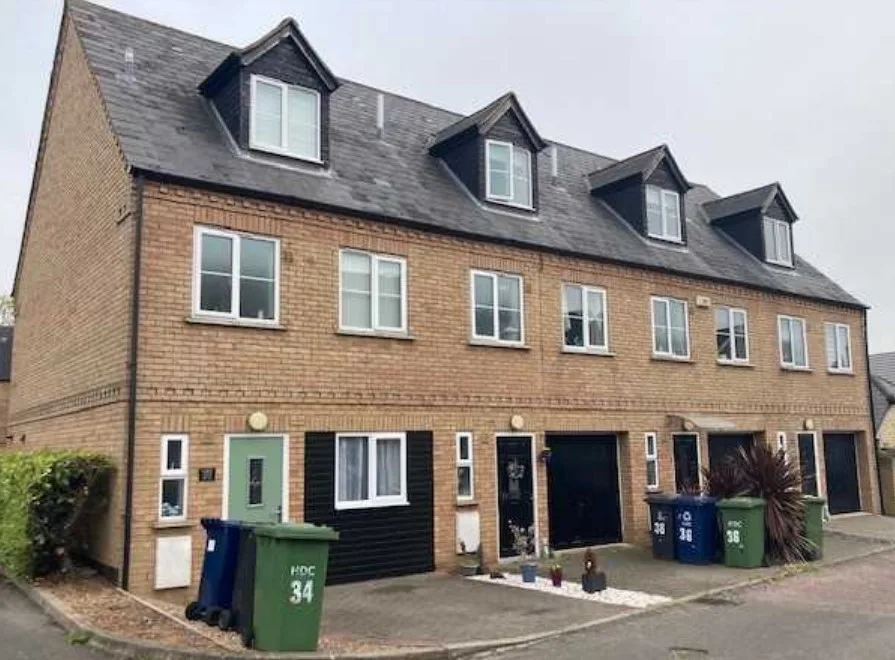 An Englishman’s home is his castle – and in this case, at St Neots, his garage is too. So, he can use it as a bedroom (end terrace)