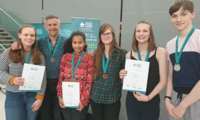 Image caption: Young people receiving their Youth STEMM Award medal from YSA ambassador Mark Thompson (BBC Stargazing Live broadcaster and author). Image credit: John Innes Centre.