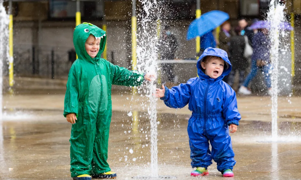 Flashback to 2021 and the fountains in Peterborough were particularly popular with these two youngsters. PHOTO: Terry Harris