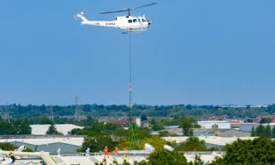 A 625,000ft sq ft factory complex under construction in Peterborough is using a Bell 205A-1 Helicopter (Helilift Services) to move construction materials to the roof of the massive factory., Delta Park, Peterborough Saturday 10 June 2023. Picture by Terry Harris.