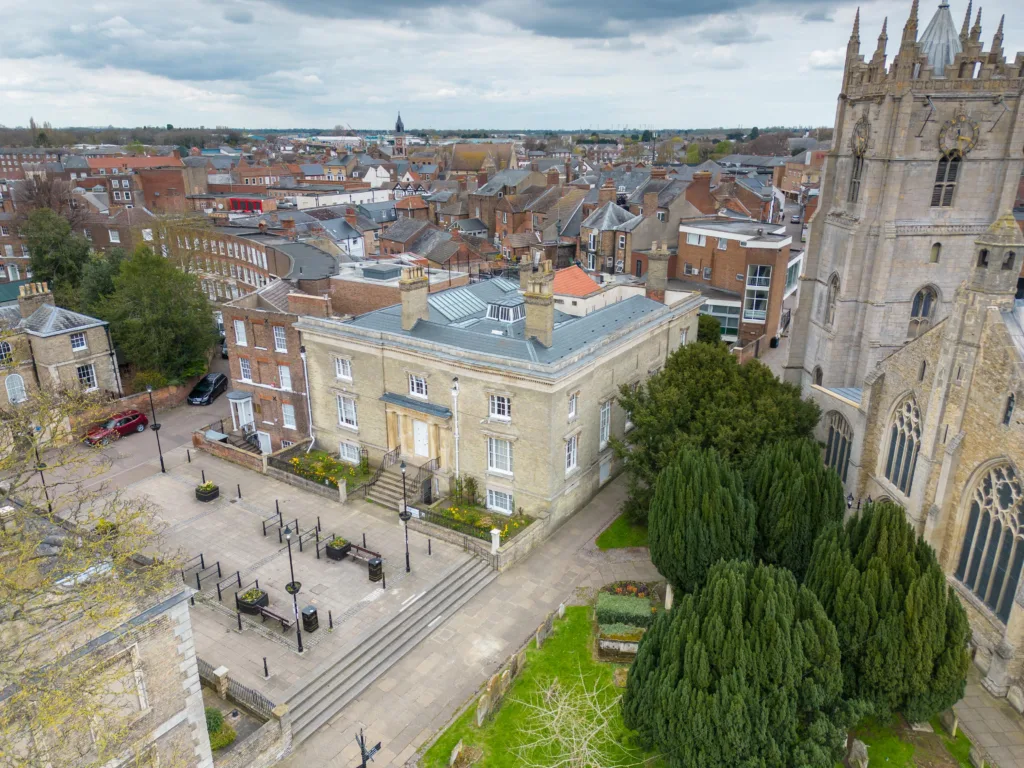 A former mayor of Wisbech has been convicted of raping a woman at her home in the town.