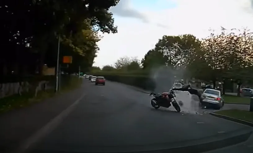 Stavius Gordon flipped off his motor bike as it burst into flames causing damage to the Audi and a nearby private ambulance. 