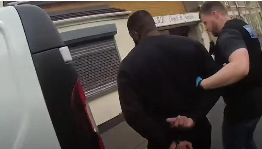 Body worn video footage of the moment Olusegun Babalola was arrested and police found £7,000 worth of heroin and crack cocaine wraps hidden within a tissue box on his kitchen worktop.