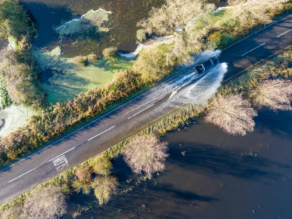 A1101 at Welney where many have chosen to find alternative routes today as water levels rise and most motorists have avoided, including those who attempted to cross but changed their mind. Bigger vehicles are still going through. PHOTO: Terry Harris for CambsNews 