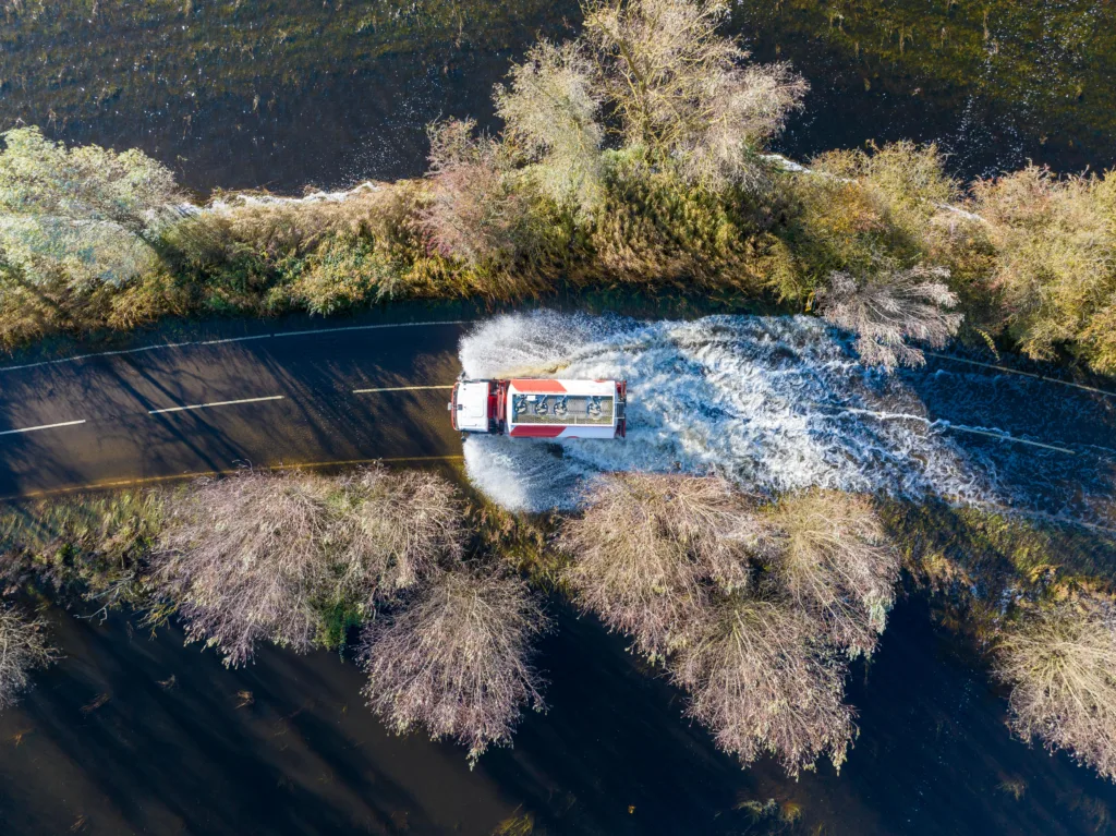 A1101 at Welney where many have chosen to find alternative routes today as water levels rise and most motorists have avoided, including those who attempted to cross but changed their mind. Bigger vehicles are still going through. PHOTO: Terry Harris for CambsNews 