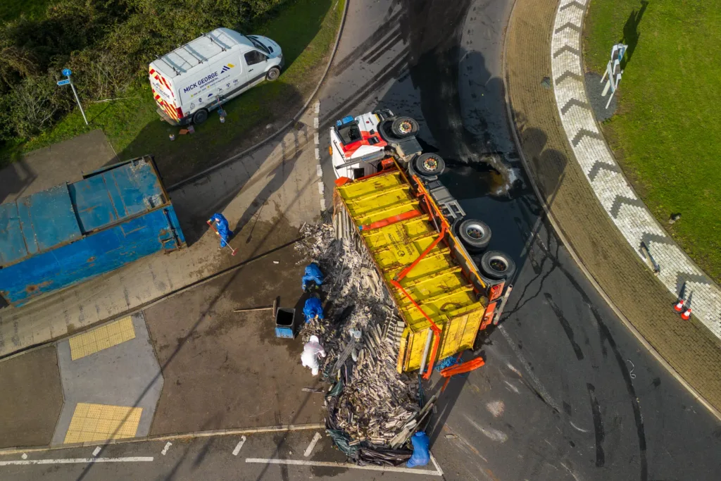 The scene at Witchford roundabout today as recovery takes place of the contents of a lorry that shed its load. PHOTO: Terry Harris for CambsNews
