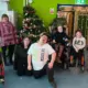 FACET students all smiles as they show off their own wonky Christmas tree