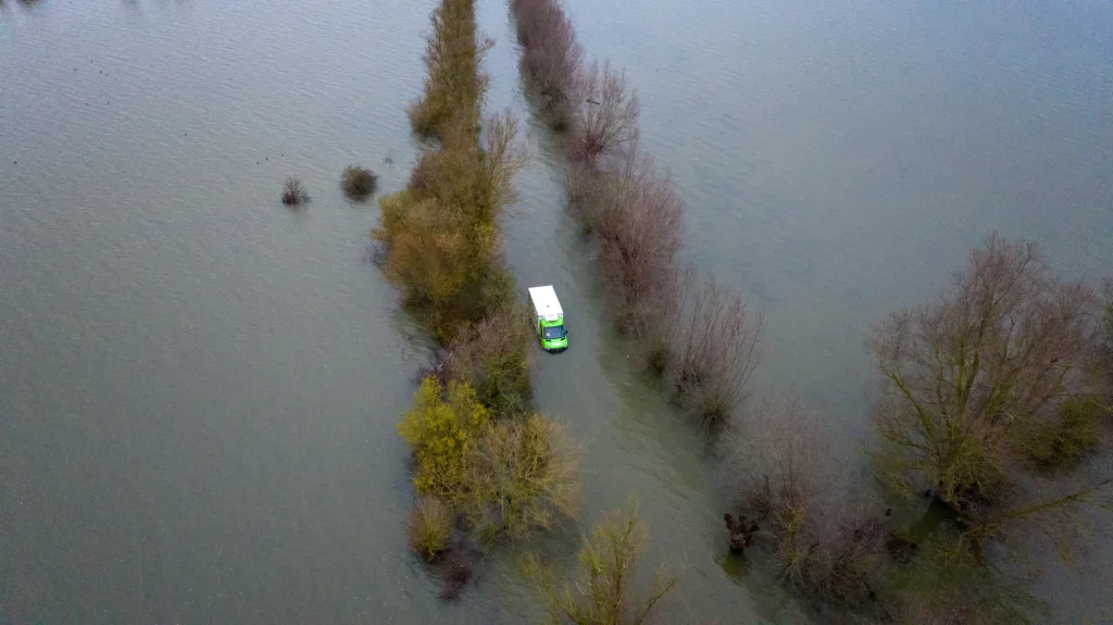 Morning after the night before: The Asda delivery van submerged in water midway through the Welney Wash Road on the A1101 bordering Cambridgeshire and Norfolk. PHOTO: Bav Media 