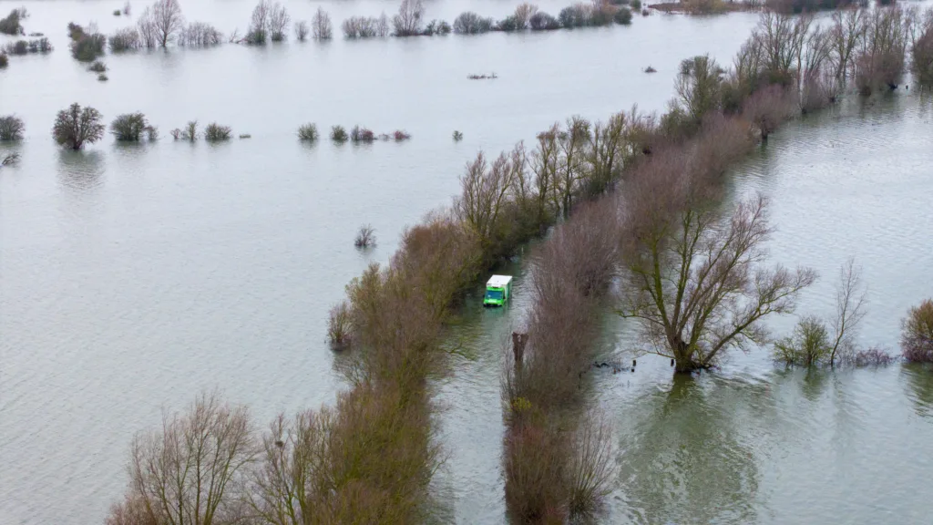 Morning after the night before: The Asda delivery van submerged in water midway through the Welney Wash Road on the A1101 bordering Cambridgeshire and Norfolk. PHOTO: Bav Media 