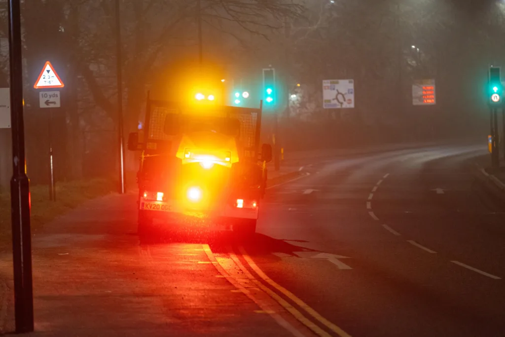 Gritter spotted driving from near TK Maxx to Railway Station Car Park along the path while gritting in the fog and dark.,Bourges Boulevard , Peterborough Saturday 02 December 2023. 