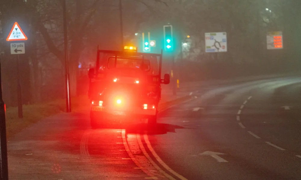 Gritter spotted driving from near TK Maxx to Railway Station Car Park along the path while gritting in the fog and dark., Bourges Boulevard , Peterborough Saturday 02 December 2023.