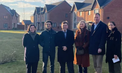 At the completed housing site, from left, Poly Bradshaw and Shamez Alibhai of Man GPM, Mayor Dr Nik Johnson, Huntingdonshire district councillors Ann Blackwell and Tom Sanderson, and Carmen Cacicedo Jaroszynska, also of Man GPM.