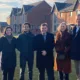 At the completed housing site, from left, Poly Bradshaw and Shamez Alibhai of Man GPM, Mayor Dr Nik Johnson, Huntingdonshire district councillors Ann Blackwell and Tom Sanderson, and Carmen Cacicedo Jaroszynska, also of Man GPM.