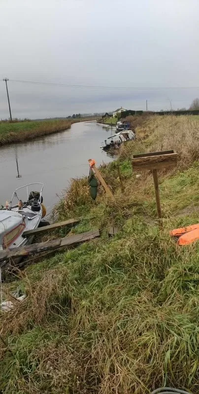 Abadon ship! The boat that came adrift from its unofficial mooring on the river at March and overturned. PHOTO: CambsNews