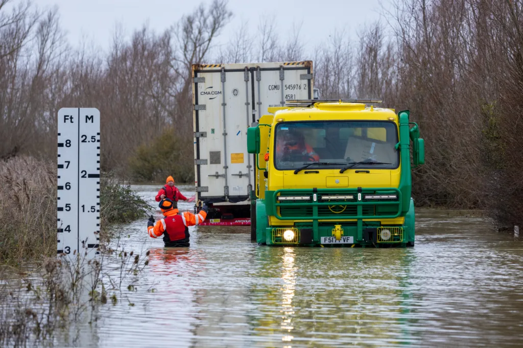 An articulated lorry was finally recovered from a flooded A1101 at Welney in Norfolk today (Thurs) after being stuck in the deep water for four days. PHOTO: Bav Media 