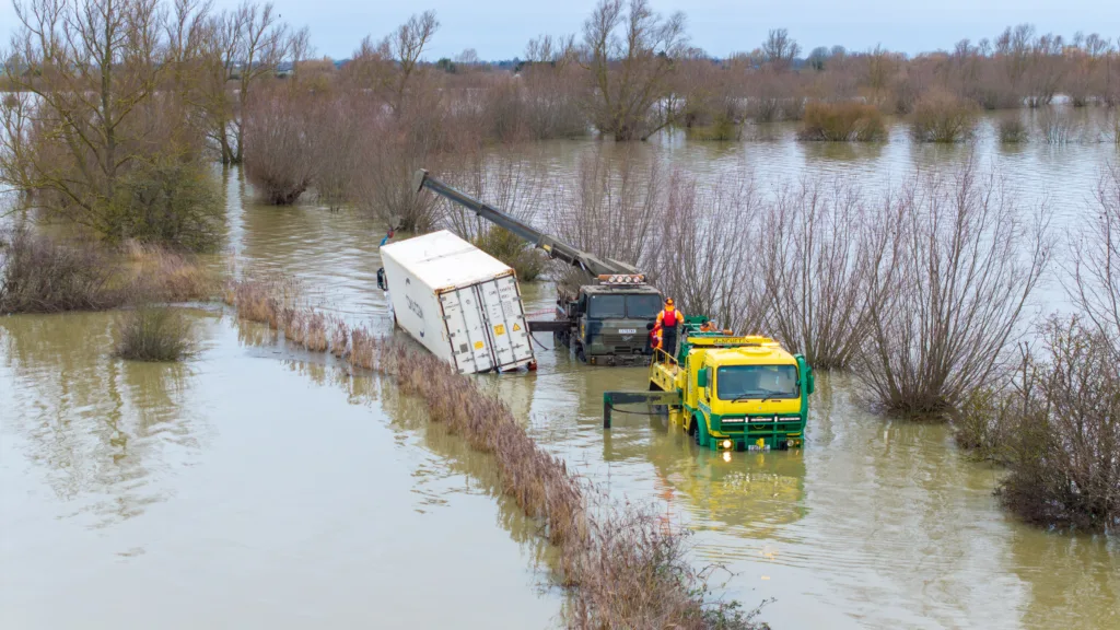 An articulated lorry was finally recovered from a flooded A1101 at Welney in Norfolk today (Thurs) after being stuck in the deep water for four days. PHOTO: Bav Media 