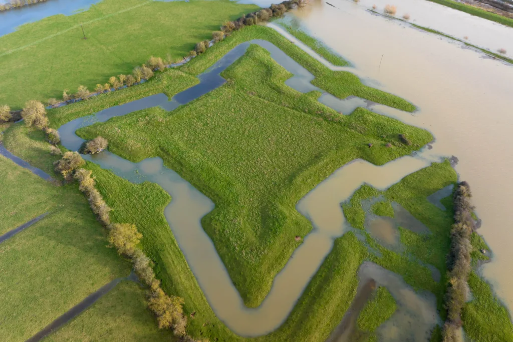 Flooding reveals English Civil War fort after Storm Henk. The clear outline of a 400-year-old English Civil War fort has been highlighted after heavy rain and flooding filled a moat around the earthworks following Storm Henk. Aerial photos show The Earith Bulwark in the Cambridgeshire Fens, which was built around 1643 by Oliver Cromwell's forces to protect crossing points on the local rivers, including the River Great Ouse. Picture by Terry Harris.