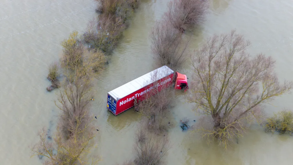 Well and truly stuck: The truck and trailer owned by Nolan Transport that attempted an unsuccessful crossing of Welney Wash road today. PHOTO: Bav Media 