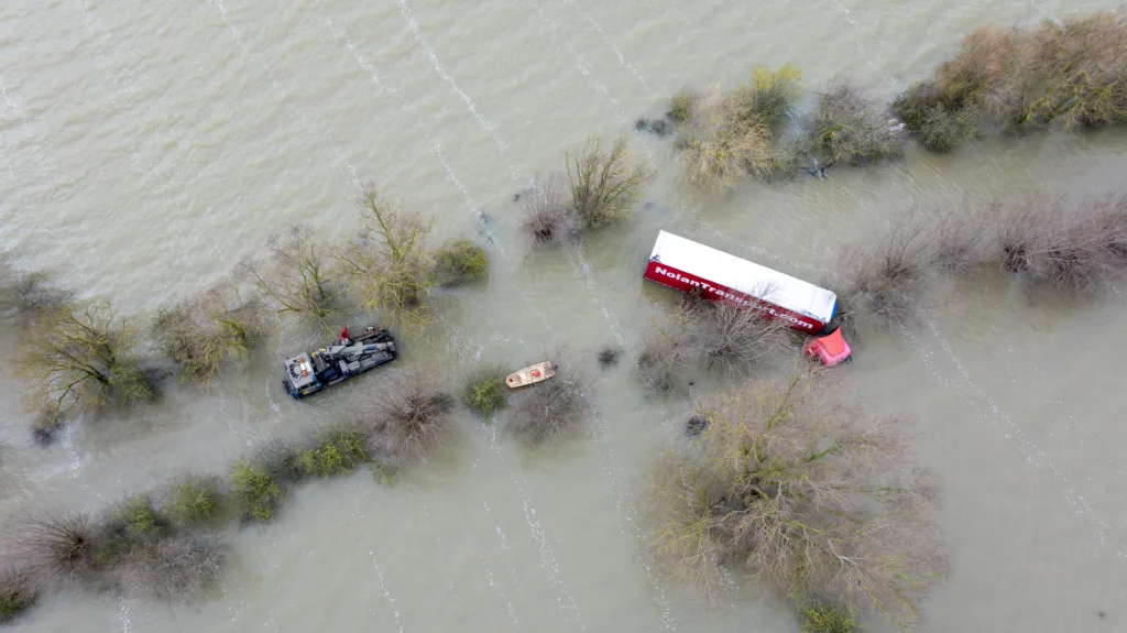 Recovery team from Manchetts were praised for their efforts in retrieving this cab and trailer that the driver was forced to abandon in the early hours of Monday on the flooded A1101 Welney Wash Road. PHOTO: Bav Media 