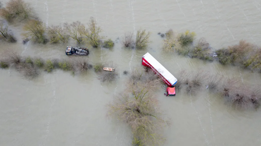 Recovery team from Manchetts were praised for their efforts in retrieving this cab and trailer that the driver was forced to abandon in the early hours of Monday on the flooded A1101 Welney Wash Road. PHOTO: Bav Media 