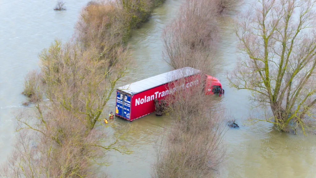 Recovery team from Manchetts were praised for their efforts in retrieving this cab and trailer that the driver was forced to abandon in the early hours of Monday on the flooded A1101 Welney Wash Road. PHOTO: Bav Media 