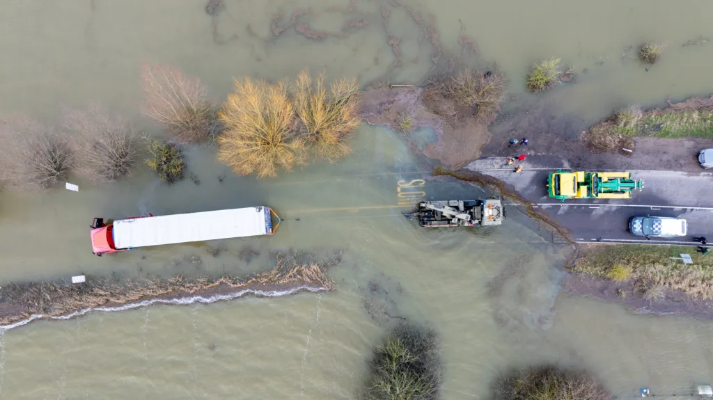 Recovery team from Manchetts were praised for their efforts in retrieving this cab and trailer that the driver was forced to abandon in the early hours of Monday on the flooded A1101 Welney Wash Road. PHOTO: Bav Media 