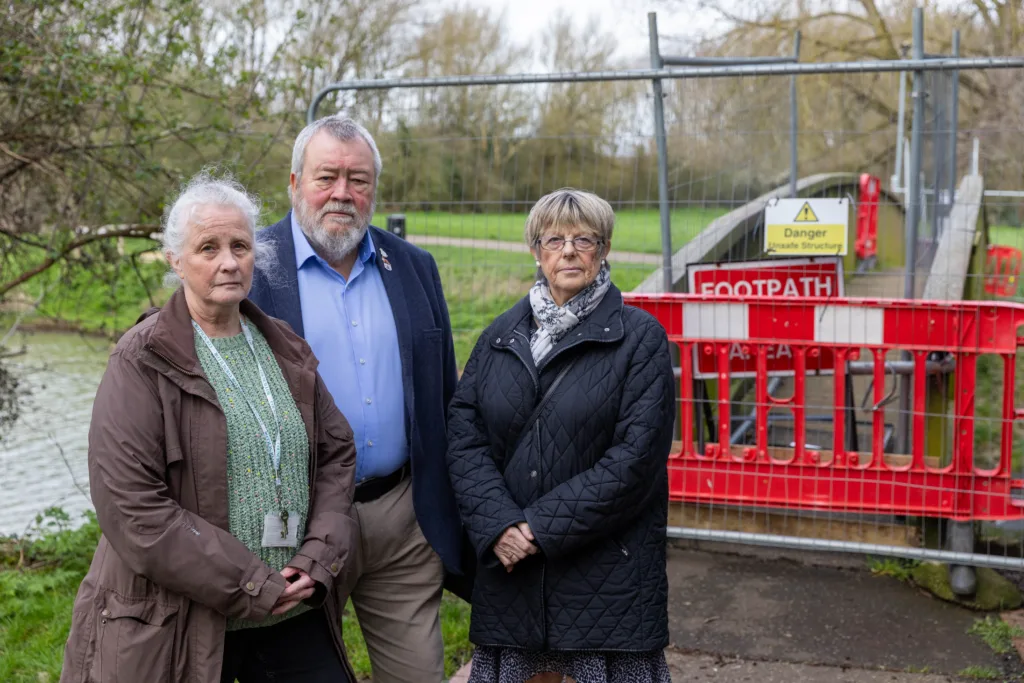 Cllr Sandra Bond, Cllr John Fox and Cllr Judy Fox at the bridges at Cuckoos Hollow, Peterborough, which MP Paul Bristow wants re-opened despite warnings for public safety over their poor condition. PHOTO: Terry Harris 