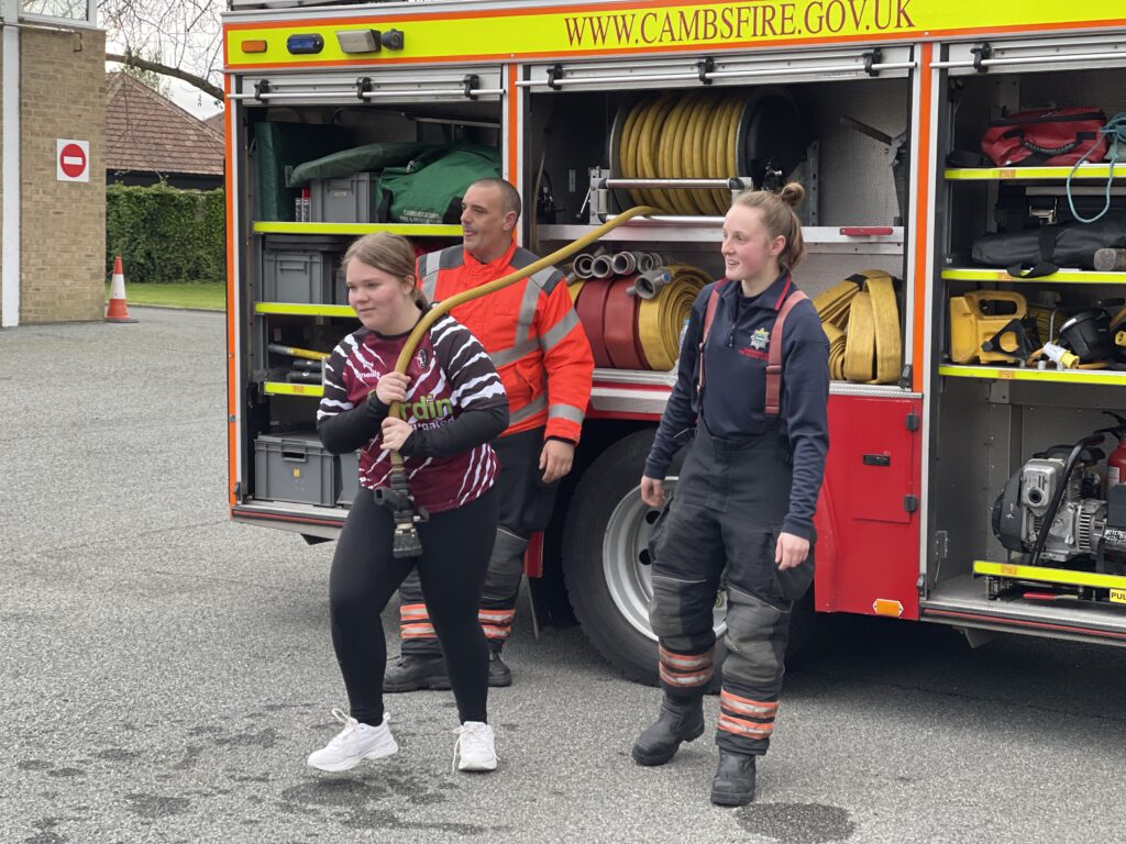 The women’s team of March Bears Rugby Club learn some basic fire fighter techniques during a visit to March Fire Station. PHOTO: Cambs Fire and Rescue