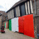 Wisbech town councillor Shahid Rafique facing an outcry after he painted a 15th century listed building red, white and green – to match the colours of his Italian Affairs restaurant