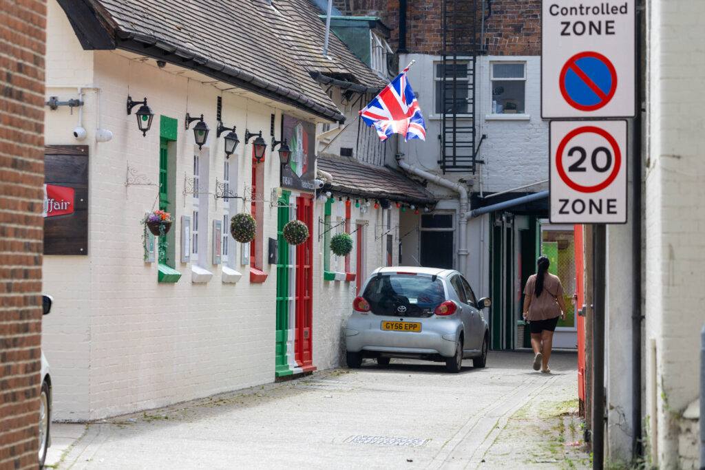 Wisbech town councillor Shahid Rafique facing an outcry after he painted a 15th century listed building red, white and green – to match the colours of his Italian Affairs restaurant 