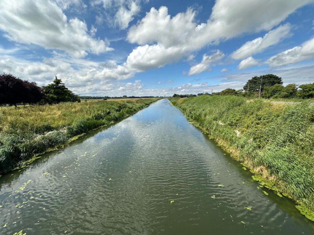 Twenty Foot river at March where a woman’s body was recovered yesterday: police describe the death as ‘unexplained’ as they search for a man, also in 80s. PHOTO: Terry Harris for CambsNews 