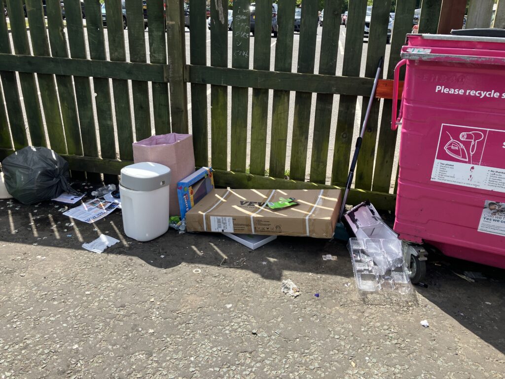 Fly tipper left a cardboard box “and personal correspondence” next to the clothing banks in the car park near Home Bargains in Cambourne.