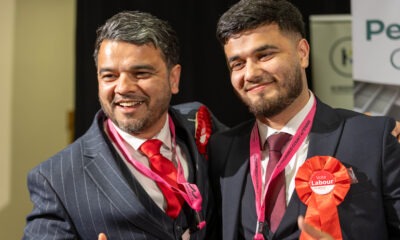 Councillor Amjad Iqbal (left) celebrating his election success in May PHOTO: Terry Harris